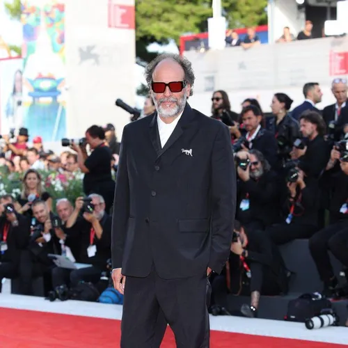 Luca Guadagnino Shines in Prada and Cartier at the Venice Film Festival Red Carpet